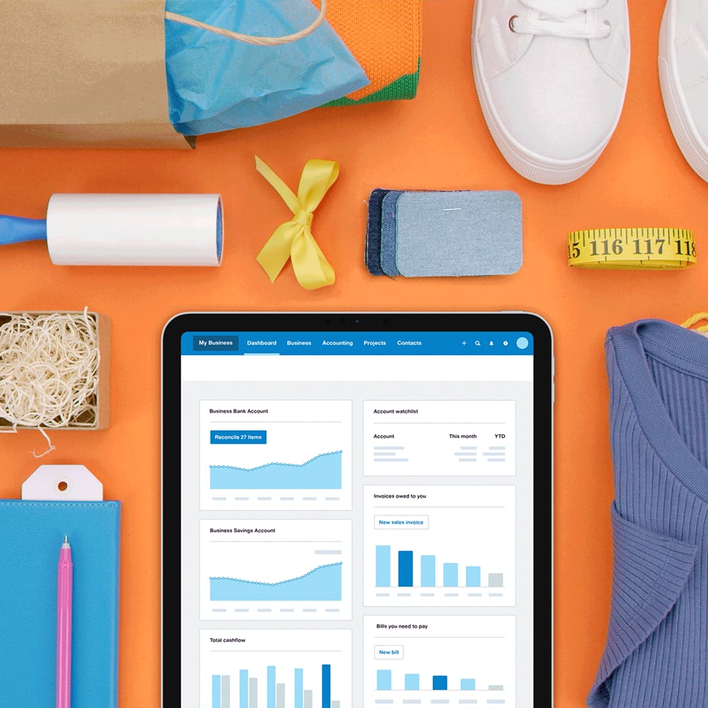 The Xero dashboard open on an iPad, surrounded by a shopping bag, and a range of new purchases.
